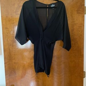 Black romper. Size small. Sheer top (sleeves). Worn 1x.